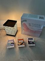 Group view of wax warmer, boxed diffuser, three wax cube packs