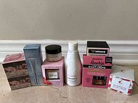 All nine boxed skincare items lined up