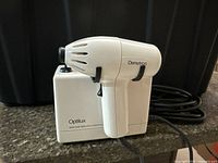 Handheld curing light attached to Optilux base