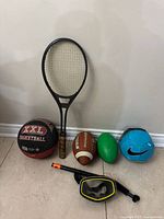 Group shot of racquet, balls, mask and snorkel