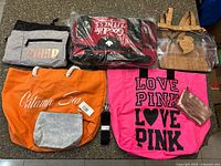 Overview of six bags and strap laid out