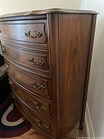 Front view showing five drawers and hardware