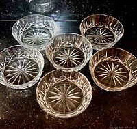 Group of six crystal bowls showing pattern and size