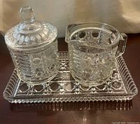 Full set showing creamer, lidded sugar bowl and tray