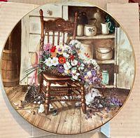 Front view of decorative plate showing artwork, colour, rim detail