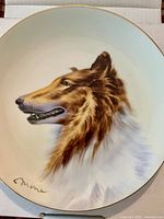 Front of porcelain plate with Lassie portrait and gold rim