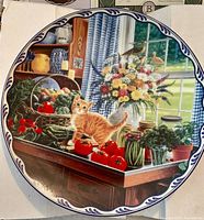 Front view of decorative plate showing artwork and rim design