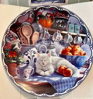 Front view of decorative plate showing artwork and border
