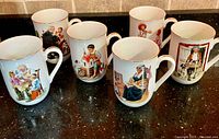 Front view of six Norman Rockwell bone china mugs showing artwork