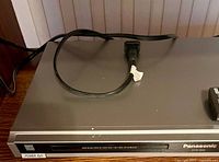 Panasonic DVD player top view with power cord