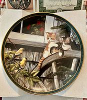 Front view of "Surprise Visit" collector plate showing artwork and rim