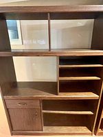 Full front view of shelving unit showing all compartments