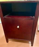 Front view showing open shelf, lower door with knob