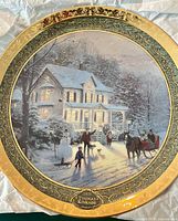 Front view of plate showing holiday scene and gold border