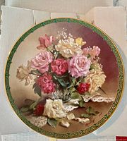 Front of porcelain plate showing rose bouquet design and border