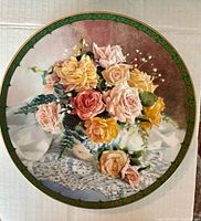 Front view of plate showing rose design and rim