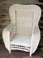 Front view of white wicker child armchair