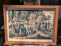 Front view of framed print showing image and wood frame