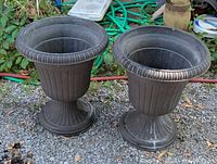 Both plastic urn planters front view