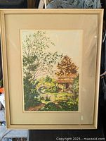 Full view of framed countryside print in frame