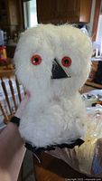 white fluffy owl-like plush front view