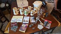 Overall lot showing mugs, snifters, ice bucket, bar tools, coasters