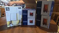 All five sealed boxes: one Libbey Vina 4-pc set and four Luminarc Brighton 4-pc sets