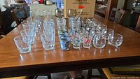 Full lot on table showing assortment of glass sizes and shapes