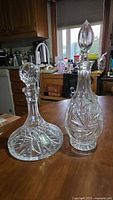 Both decanters side by side showing overall forms and stoppers