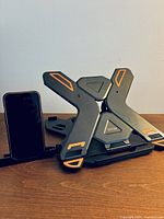 Front view of folded Besign LS01 stand with phone holder beside it