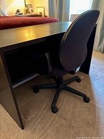 Desk front view with chair for scale