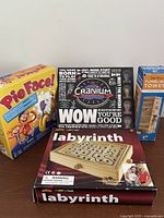 Group shot of four boxed games showing fronts and relative sizes
