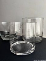 Front view of bowl and two cylinder vases