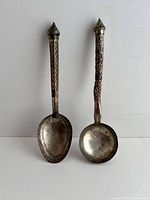 Front view of spoon and ladle showing full length, handle designs, bowl shapes