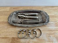 Top view of tray, tongs, picks and rings