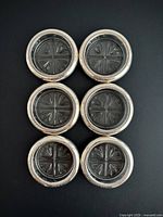 Six coasters front view showing crystal pattern and sterling rims