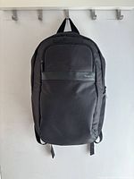 Front view of black Targus backpack hanging