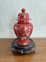 Ginger jar on wooden stand with lid in place