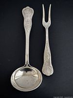 Top view of ladle and fork showing full length and prongs