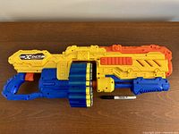 Full view of X-Shot Turbo Advance blaster with drum and Sharpie for scale