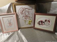 Group shot of the three framed embroidered cat pictures