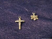 Front view of both pendants on dark fabric