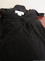 Dress folded showing lint and fabric texture