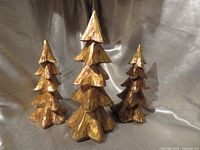 Front view of three wooden Christmas trees
