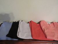 Five folded tops showing colors