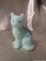Front view of light blue satin glass cat figurine