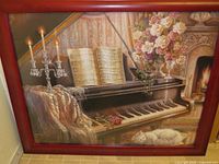 Front view of framed J. Gibson print showing piano still life scene