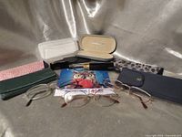 Overall view of eyeglasses, cases and cloth