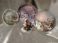 All three collector plates and Boyds Bears figurine displayed together