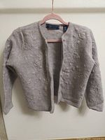 Front view of cardigan showing embroidery and overall condition